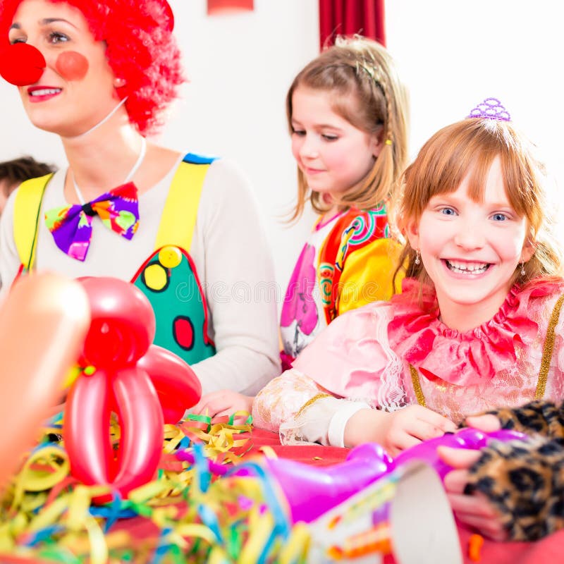 Clown at children birthday party with kids royalty free stock images Clown at children birthday party with kids royalty free stock images