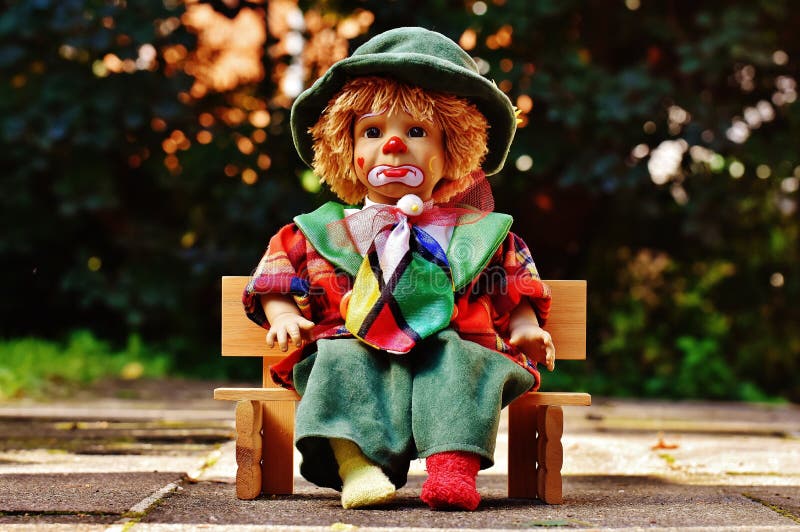Clown Doll On Bench Outdoors Picture. Image: 94945399 Clown Doll On Bench Outdoors Picture. Image: 94945399