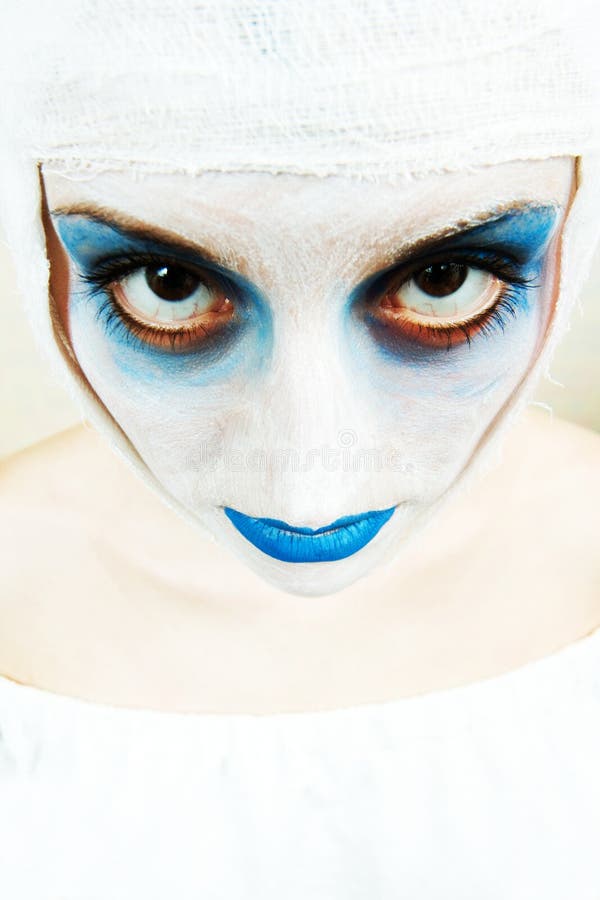 Spooky female clown in heavy stage make-up. Spooky female clown in heavy stage make-up