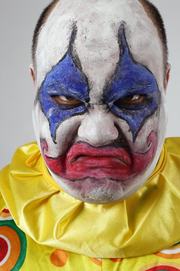A nasty evil clown, angry and looking mean. A nasty evil clown, angry and looking mean.