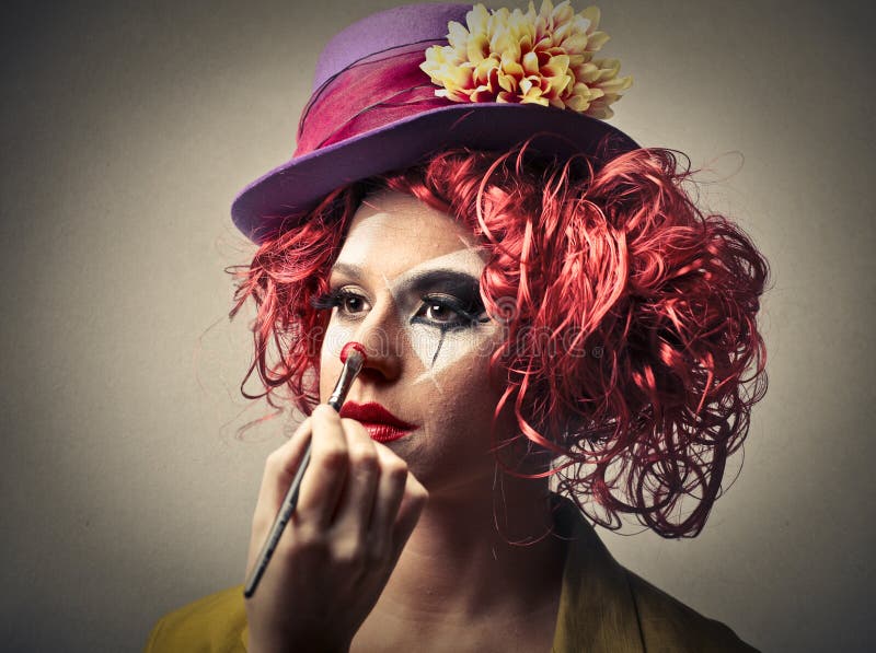 Clown putting on some make-up stock image Clown putting on some make-up stock image
