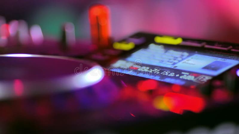 Club: DJ playing on turntables