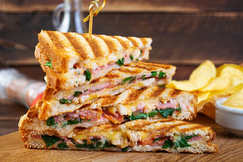 Club Sandwich with Ham, Cheese, Tomato, Salad and Chips Stock Image
