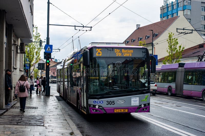 CLUJ-NAPOKA, ROMANIA - April 27, 2022. Trolleybus Solaris Trollino 18 305 riding with passengers in the streets of Cluj-Napoka.