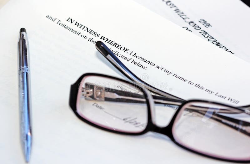 Signing a last will and testament. An image of the last clause of the testament, a pair of glasses and a pen. Signing a last will and testament. An image of the last clause of the testament, a pair of glasses and a pen