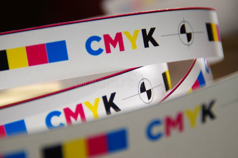 CMYK test printed on white paper. Cyan, magenta, yellow, black and registration mark. CMYK test printed on white paper. Cyan, magenta, yellow, black and registration mark.