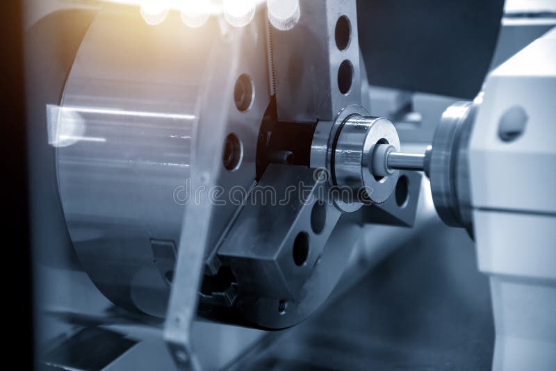 The CNC grinder machine grinding inside the metal ring. stock images