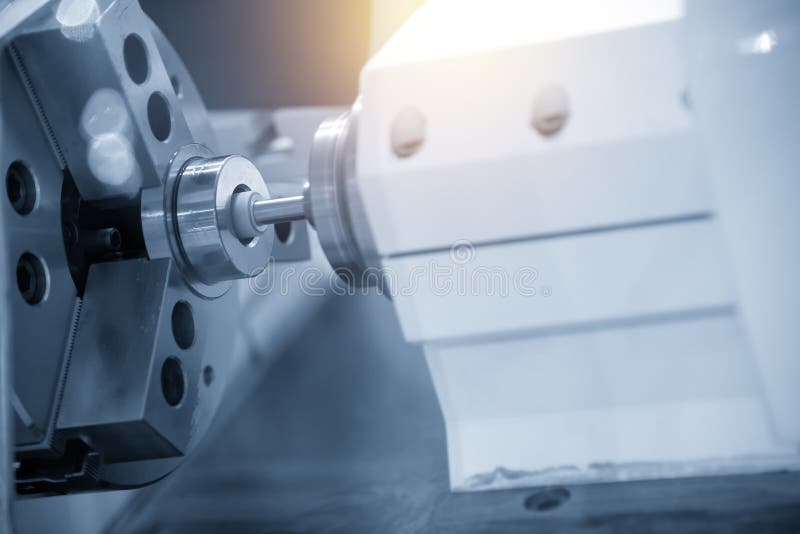 The CNC grinder machine grinding inside the metal ring. royalty free stock photo