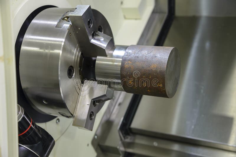 Close Up of the CNC Lathe Jaw Clamping Raw Material Steel Rod . Stock