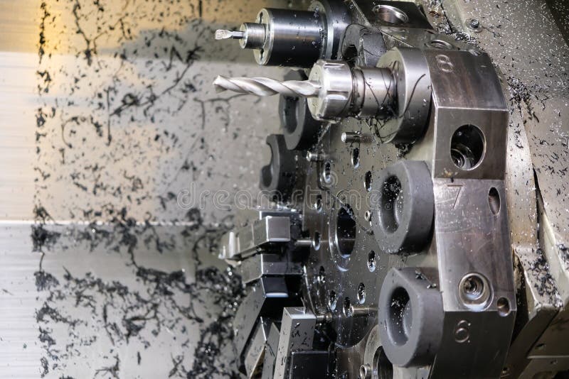 The CNC Lathe Machine. Turning Machine for Drilling with the Drill Tool and Center Drill Tool