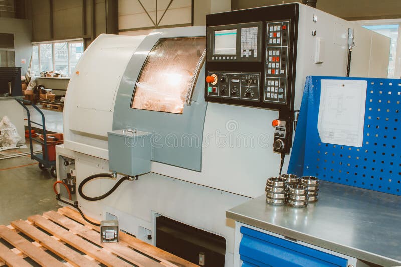 The CNC Lathe Machine. Turning Machine for Drilling with the Drill Tool and Center Drill Tool