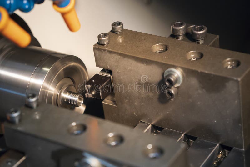 The CNC lathe or turning machine making the tread stock photo