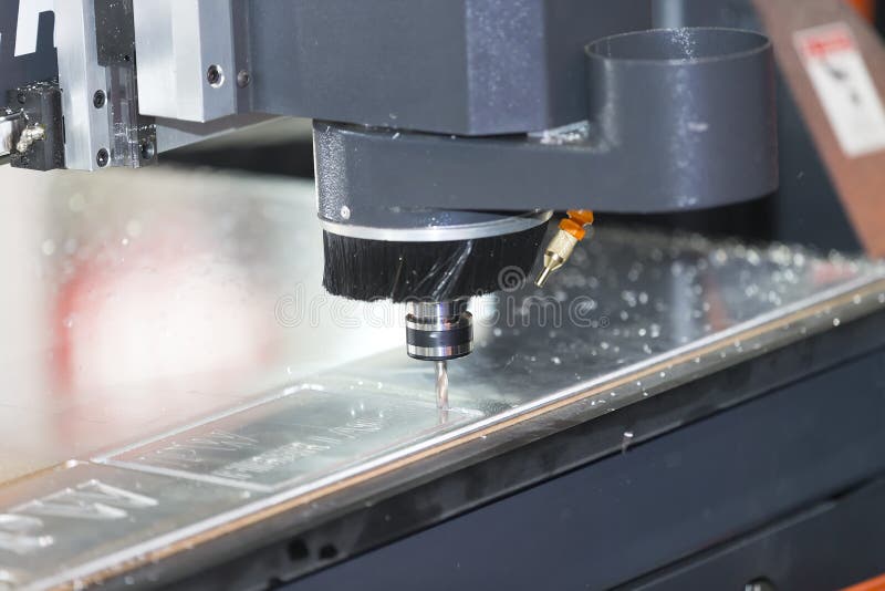 CNC machine cutting acrylic plate royalty free stock photos