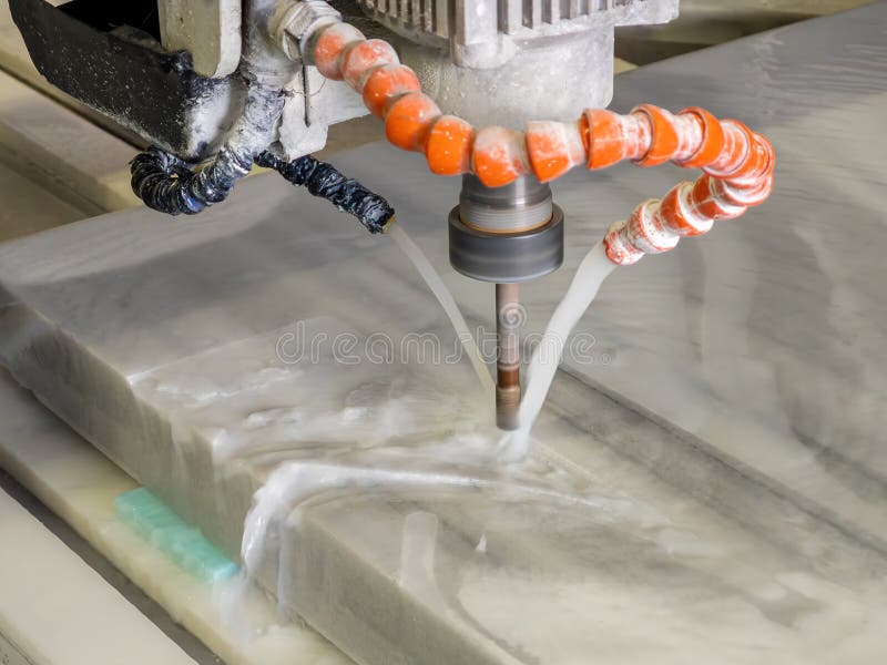 CNC Machine Drilling and Cutting Stone with Cooling Water. royalty free stock photography