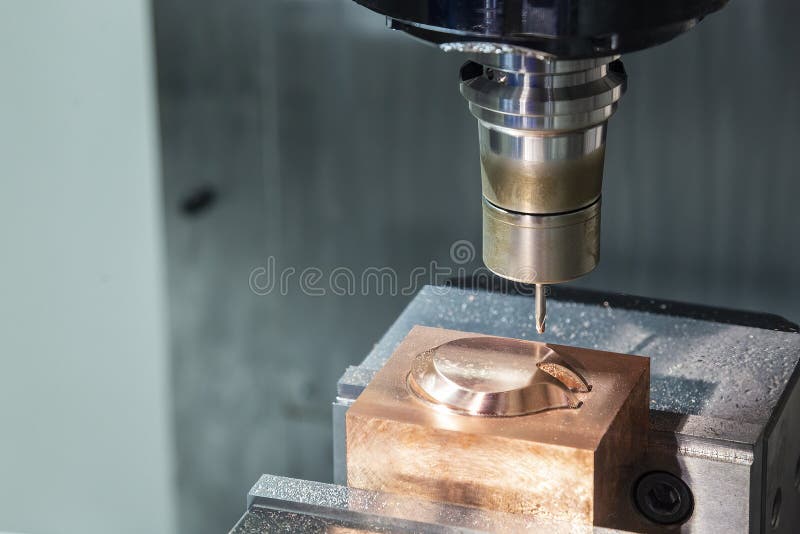 The CNC Milling Machine Cutting the Copper Electrode Parts with Solid Ball End Mill Stock Photo