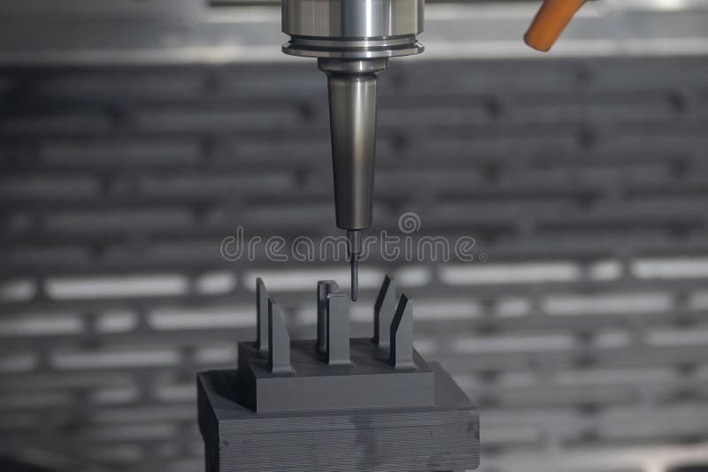The CNC Milling Machine Cutting the Graphite Electrode Parts with Solid