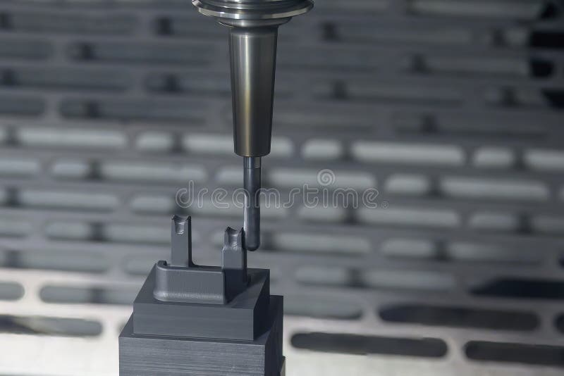 The CNC Milling Machine Cutting the Graphite Electrode Parts with Solid
