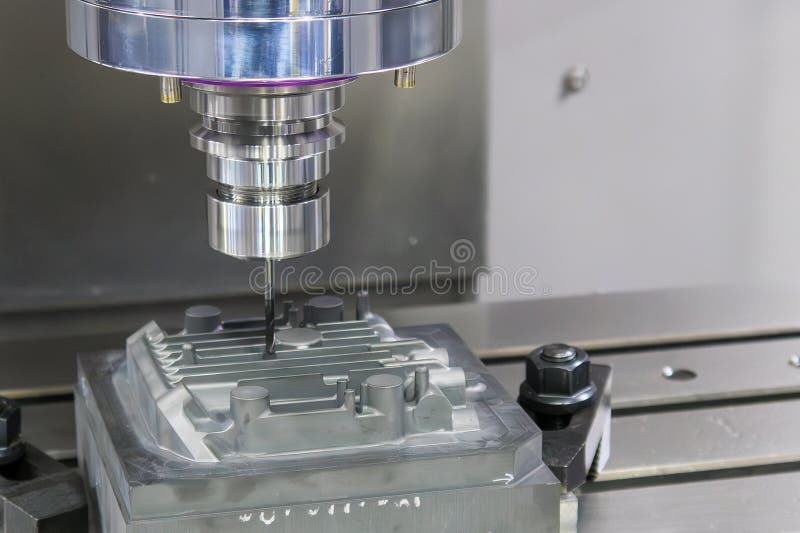 The CNC milling machine finish cut the mold parts by solid ball nose end mill tool royalty free stock photography