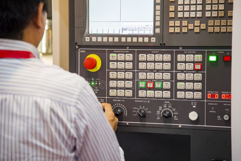 The CNC Milling Machine Operator with Control Board. Stock Photo