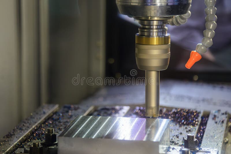 The CNC milling machine rough cutting the mold parts by indexable tools stock photography
