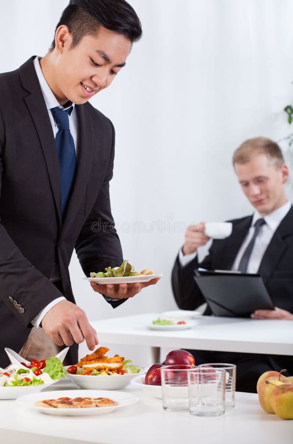 Coworkers Eating Lunch during Meeting Stock Image Image of meeting