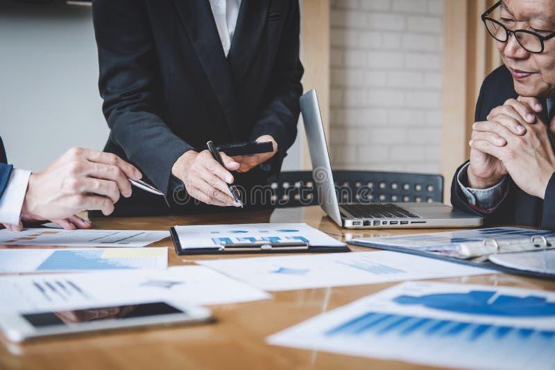 Co working conference, Business team colleagues discussing working analysis with financial data and marketing growth report graph stock photo