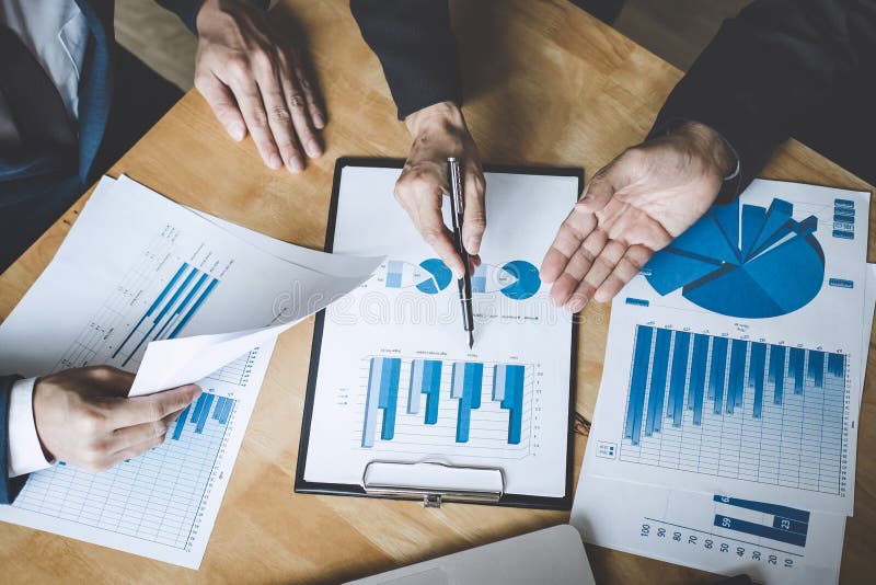 Co working conference, Business team colleagues discussing working analysis with financial data and marketing growth report graph royalty free stock image