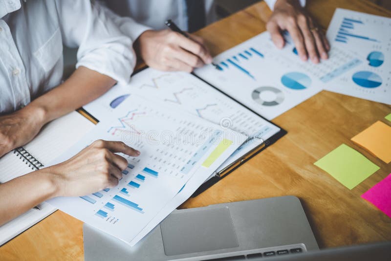 Co working conference, Business team meeting present discussing working analysis with financial data and marketing growth report stock image