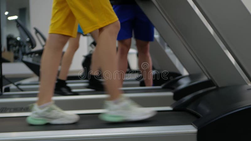 Coach helps children perform physical exercises in gym. sporty, healthy lifestyle, concept. Schoolchildren jogging and