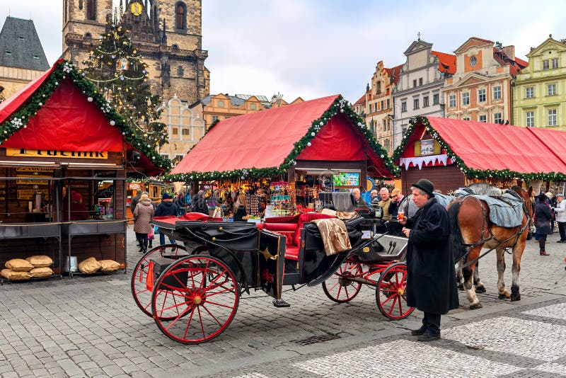 Coach on Old Town Square of Prague during Christmas market. royalty free stock images Coach on Old Town Square of Prague during Christmas market. royalty free stock images