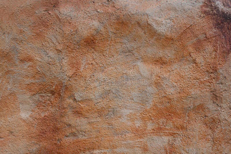 Coarse cement surface with orange stains texture royalty free stock photography