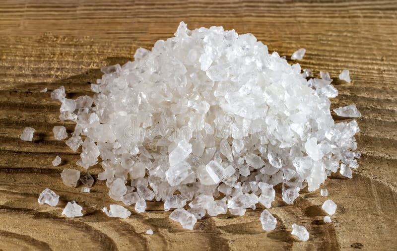 Table Salt Closeup on Wood Background. Stock Photo Image of salt