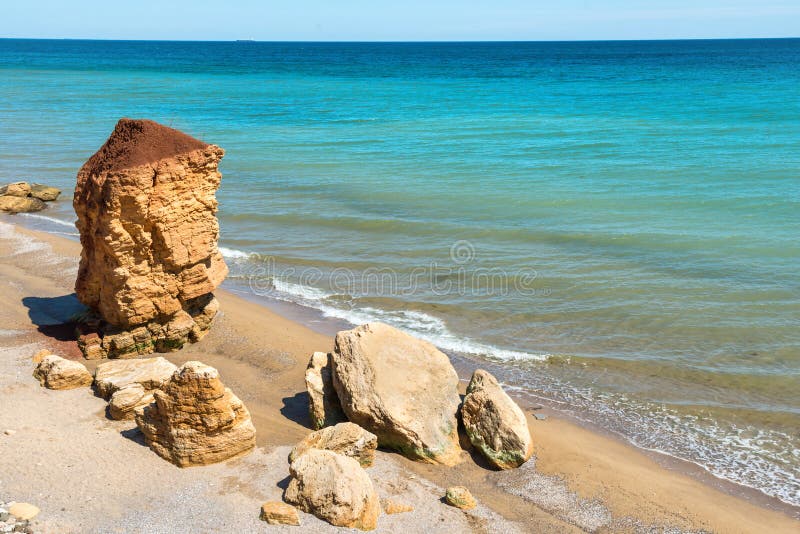 Coast with rock, surf and sea