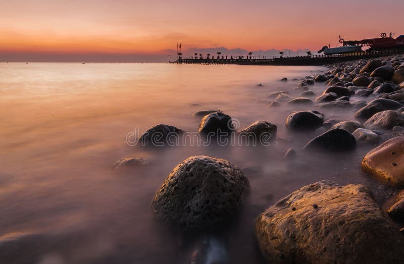 Coastal rocks in the sea before dawn