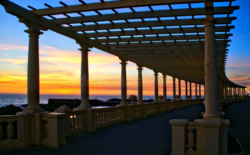Coastal way sunset with Pergola at Foz do Douro stock photo Coastal way sunset with Pergola at Foz do Douro stock photo