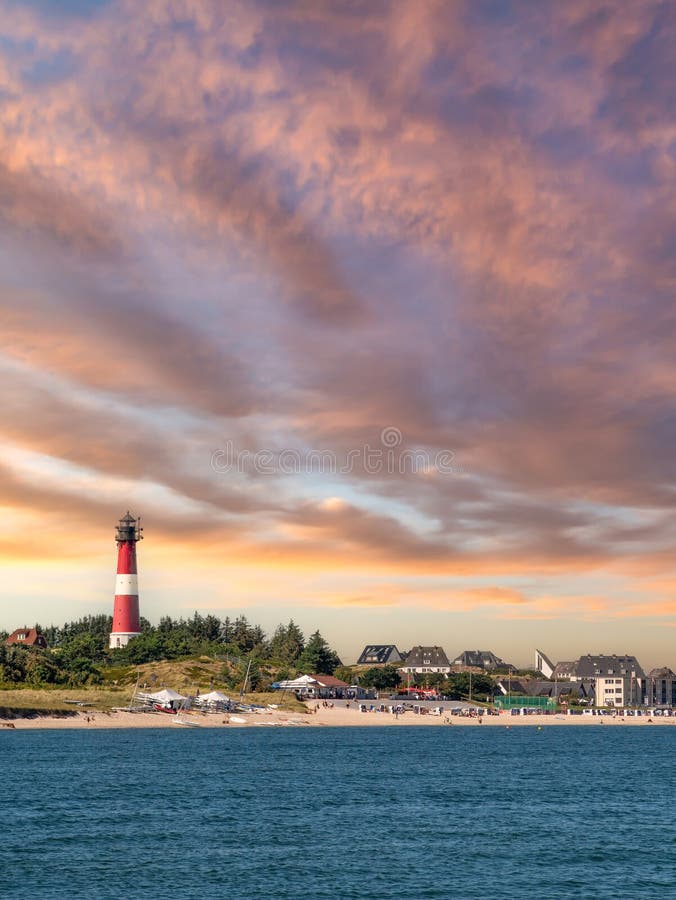 Coastline of Hornum with lighthouse at sunset, Sylt island, North Frisia, Schleswig-Holstein, Germany