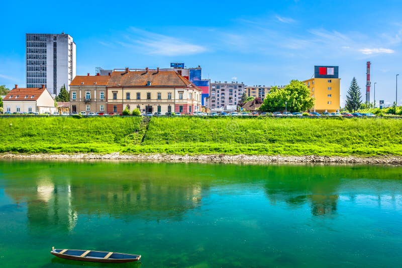 Coastline in Karlovac, Korana river. Waterfront view at Karlovac coastline town in Croatia, Korana river scenery stock photo Coastline in Karlovac, Korana river. Waterfront view at Karlovac coastline town in Croatia, Korana river scenery stock photo