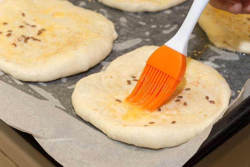 Coating the Dough with the Egg Yolk and Brush Stock Image Image of