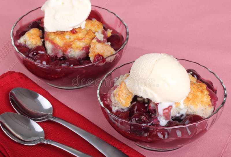 Cherry cobbler dessert with a scoop of ice cream. Cherry cobbler dessert with a scoop of ice cream
