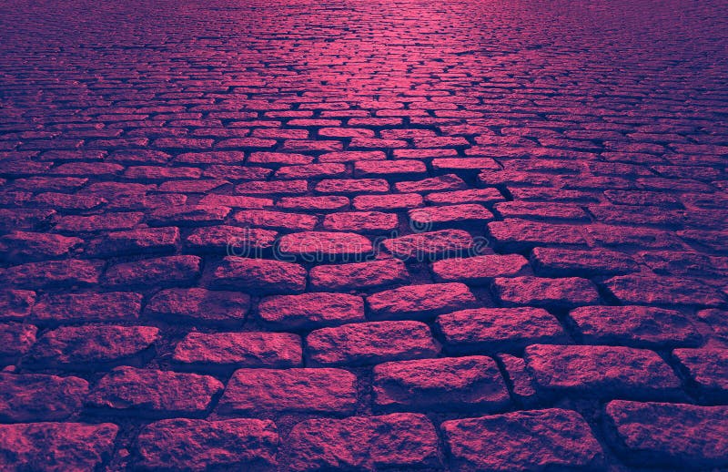 Cobblestone street abstract background texture in pink and blue