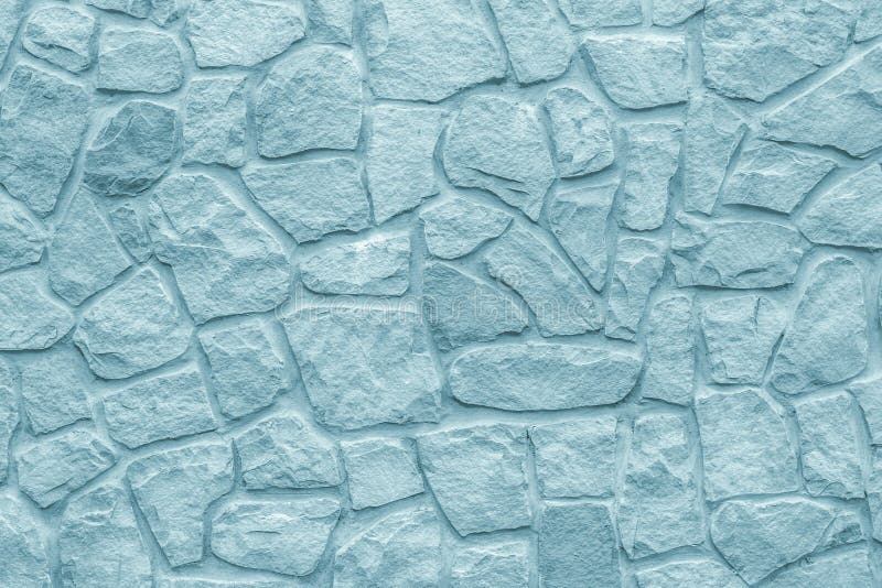Cobblestones wall, gray background. Light blue texture of stone wall. Masonry rough surface, modern design. Grey bricks, natural p