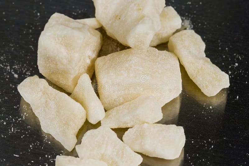 Crack, a type of drug obtained through chemical processes from cocaine. Amazing substance in small pieces. Crack is produced by dissolving powdered cocaine in a mixture of water and ammonia or sodium bicarbonate. The mixture is dried, and then broken into the chunks (rocks) that are sold as crack cocaine. Crack, a type of drug obtained through chemical processes from cocaine. Amazing substance in small pieces. Crack is produced by dissolving powdered cocaine in a mixture of water and ammonia or sodium bicarbonate. The mixture is dried, and then broken into the chunks (rocks) that are sold as crack cocaine