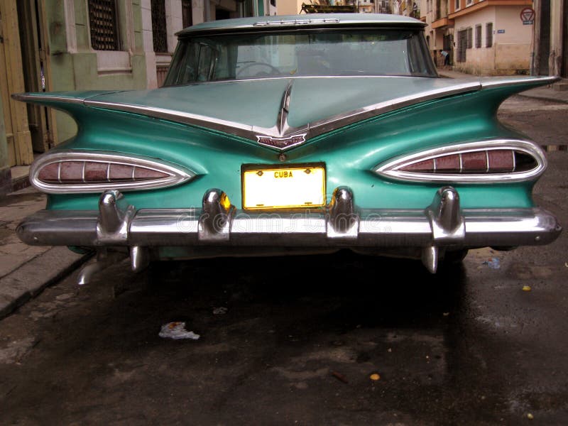 View of the rear side of an old cuban car in a street in Havana Cuba. View of the rear side of an old cuban car in a street in Havana Cuba