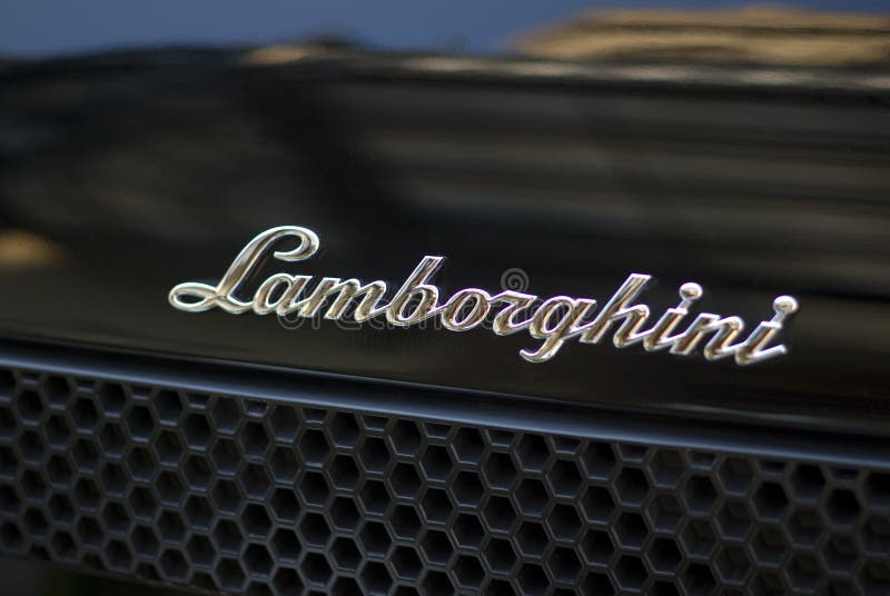 Lamborghini logo on black sports car. Lamborghini logo on black sports car