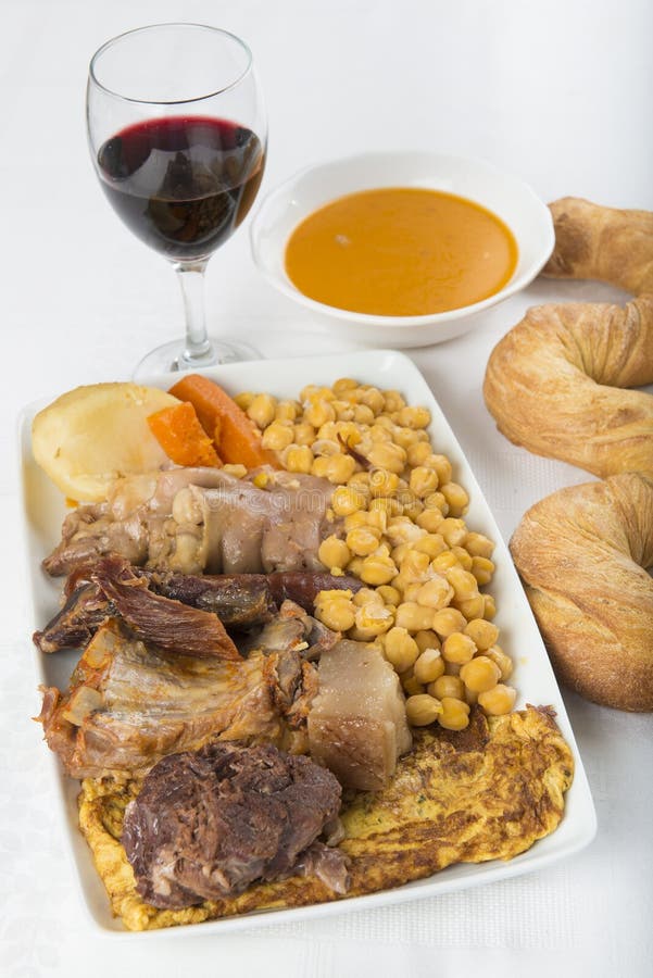 Cocido a Spanish Stew with Assortment of Meat and Chikpeas Stock Photo Image of bread, bones