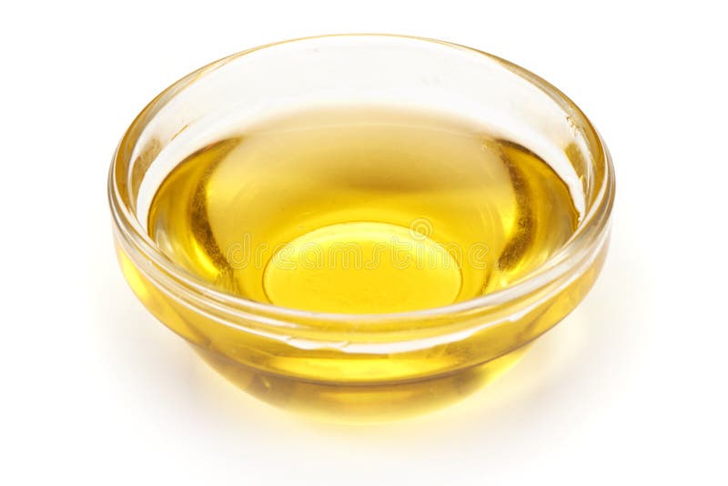 Cocinar el aceite vegetal en una taza pequeña, de cristal, aislada en el fondo blanco foto de archivo libre de regalías Cocinar el aceite vegetal en una taza pequeña, de cristal, aislada en el fondo blanco foto de archivo libre de regalías