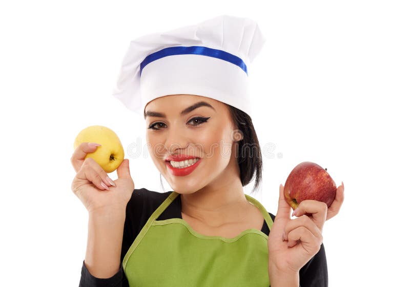 Cocinero de la mujer que sostiene manzanas fotos de archivo Cocinero de la mujer que sostiene manzanas fotos de archivo