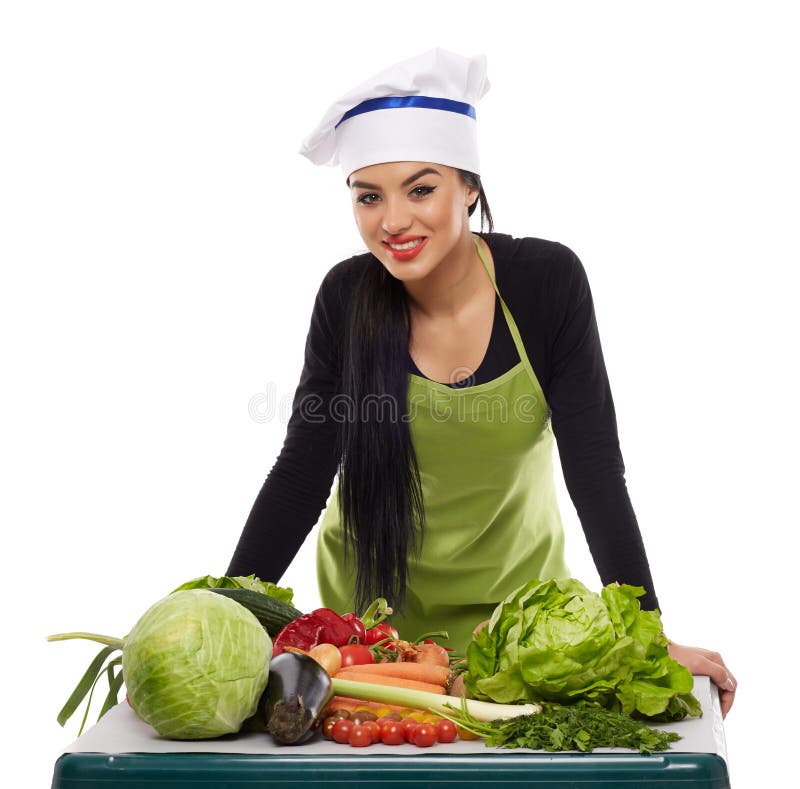 Cocinero feliz con una tabla de verduras fotos de archivo libres de regalías Cocinero feliz con una tabla de verduras fotos de archivo libres de regalías