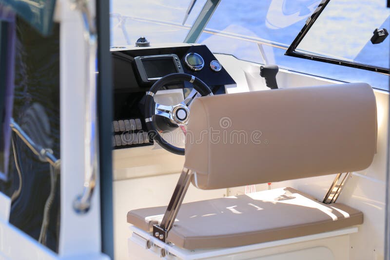 Cockpit Motor Boat with Steering Wheel and Throttle Control Stock Image