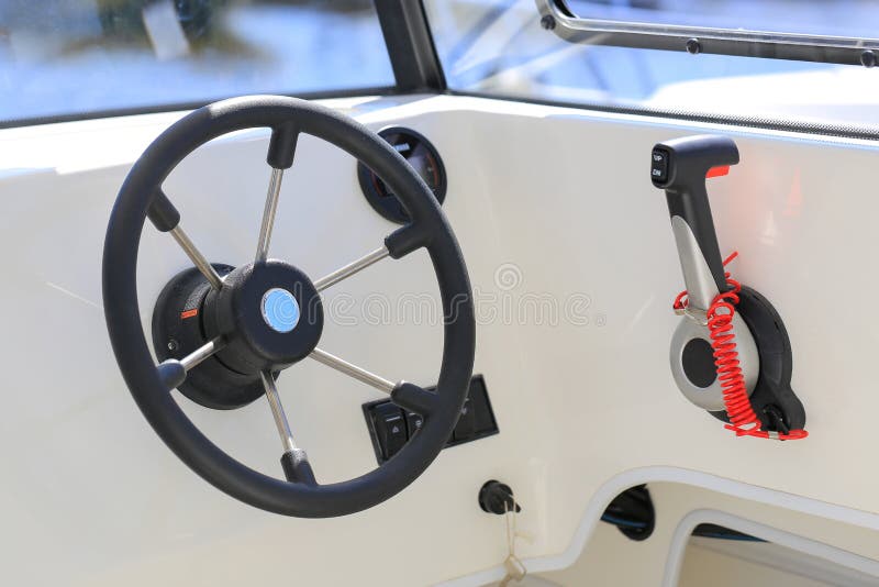 Cockpit Motor Boat with Steering Wheel and Throttle Control Stock Photo